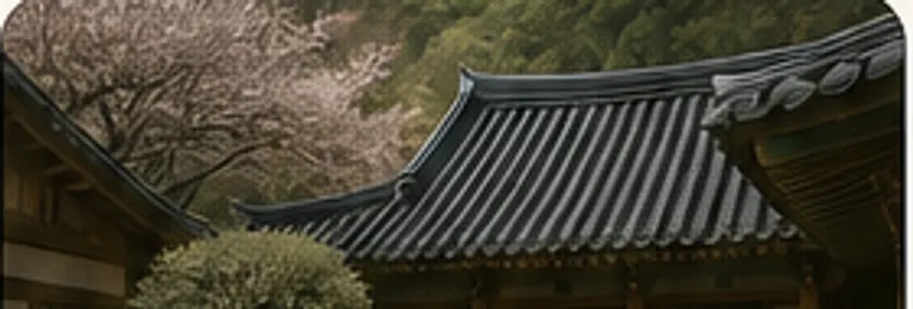 봄꽃이 핀 마당 너머로 보이는 한옥 전각의 기와지붕